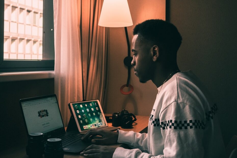 man using laptop inside room